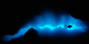 Diver in a grotto off of Roatan Island, Honduras